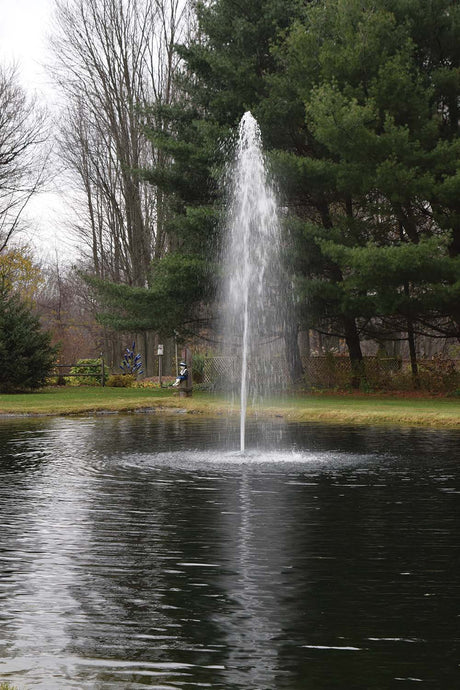 Floating fountain head with rocket nozzle, projecting a powerful stream of water skyward in a mesmerizing display